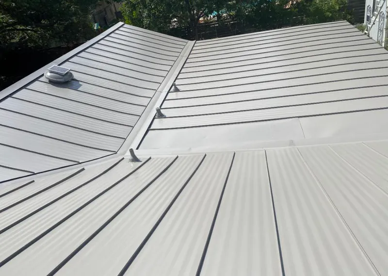Solar attic fan installed on a metal roof for Roof Ventilation in Marysville